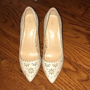 Nude pump heels with cut out flower detailing